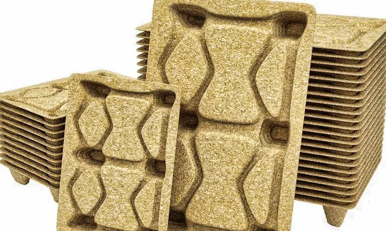 What are the most suitable raw materials for manufacturing compressed pallets, and how can they be optimized for cost-effective production?
